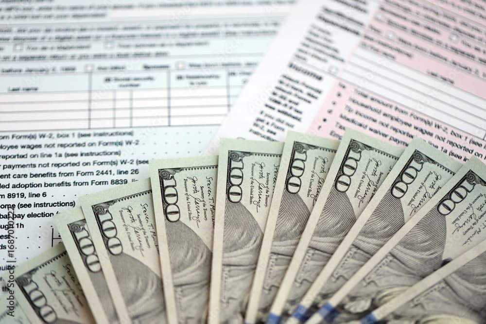 Tax forms and money representing fuel taxes